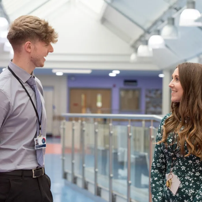 Student talking to member of staff